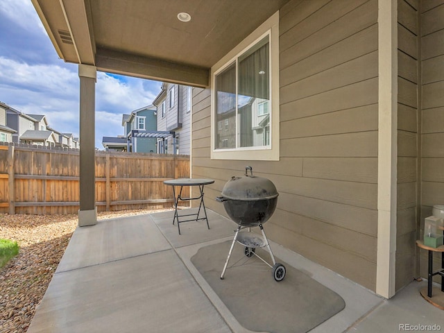 9844 Truckee St, Commerce City, CO 80022 - view of patio featuring a grill, fence, and a residential view