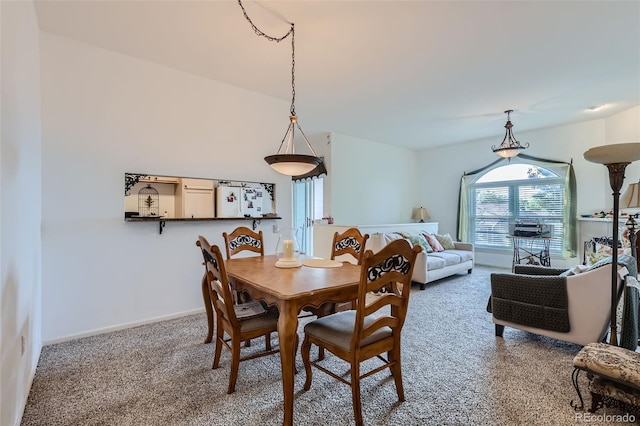 view of carpeted dining area