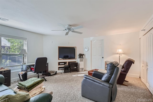 living room with light carpet and ceiling fan