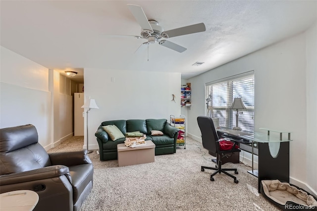 office with ceiling fan and carpet floors