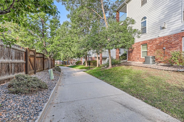 view of property's community with a lawn