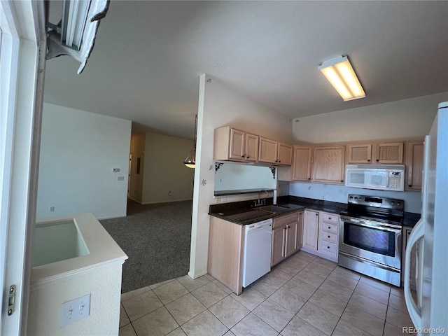 kitchen with light tile patterned floors, white appliances, light brown cabinetry, light carpet, and a sink