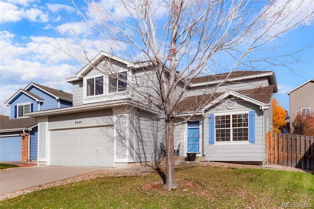 view of front property with a garage and a front lawn