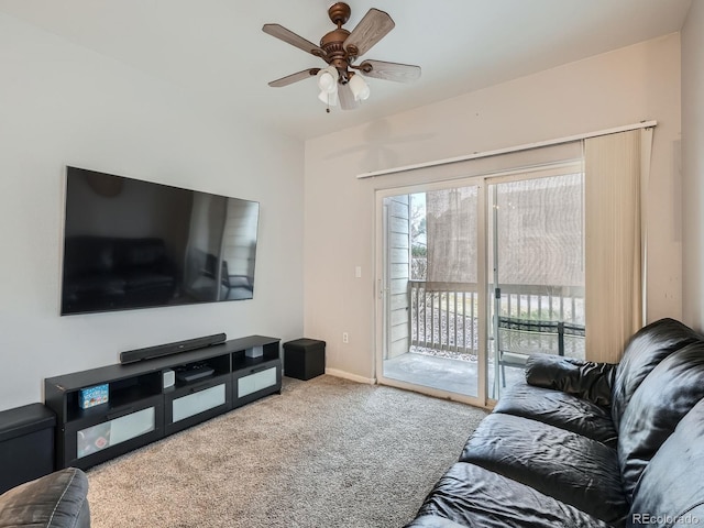 living room featuring a ceiling fan, baseboards, and carpet floors