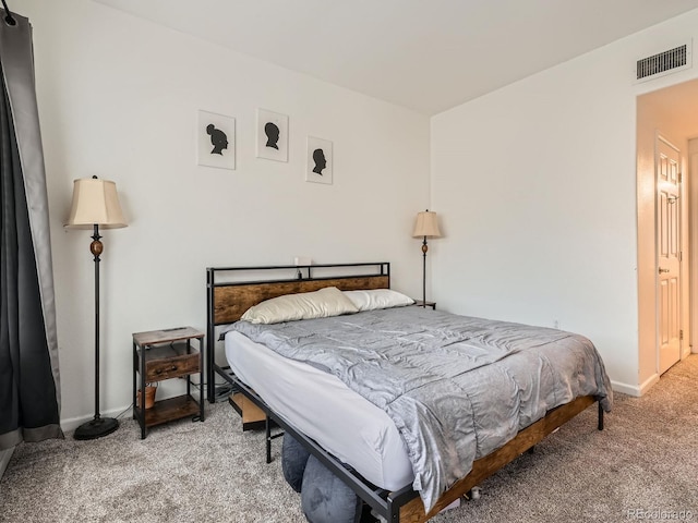 bedroom featuring light colored carpet, visible vents, and baseboards