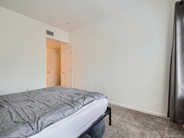 bedroom with carpet flooring, baseboards, and visible vents