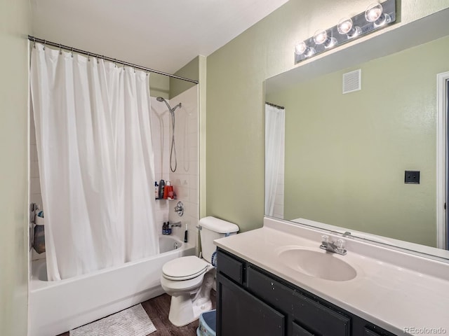 bathroom featuring visible vents, toilet, shower / bath combo with shower curtain, wood finished floors, and vanity