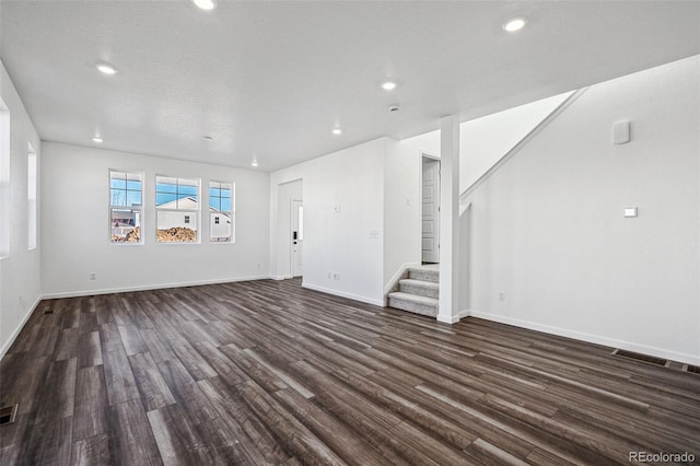 3282 N Catawba Way, Aurora, CO 80019 - unfurnished living room featuring dark hardwood / wood-style flooring