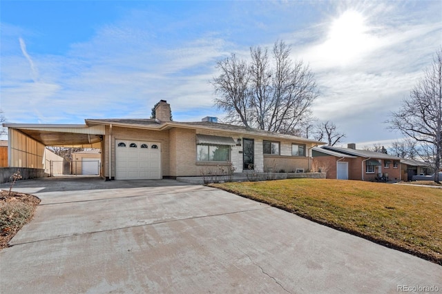 single story home with a carport, a garage, and a front yard