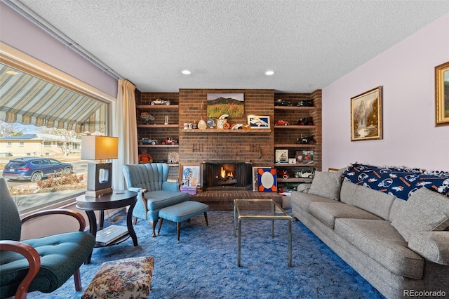 living room featuring a fireplace and a textured ceiling