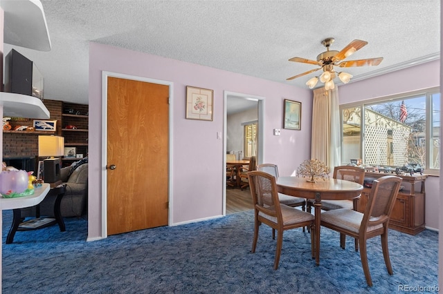 carpeted dining area with ceiling fan and a textured ceiling