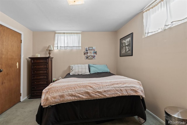 bedroom featuring light carpet