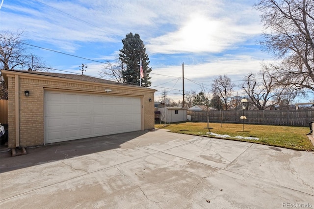 garage with a lawn