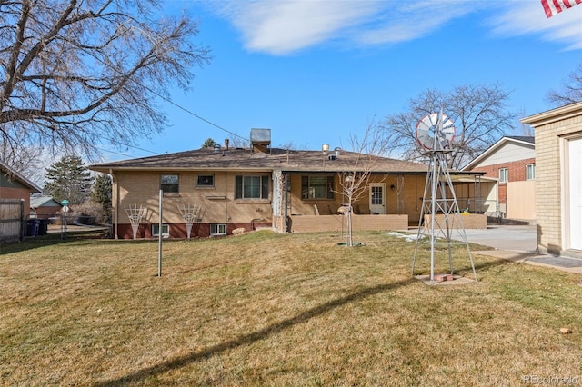 back of house with a yard