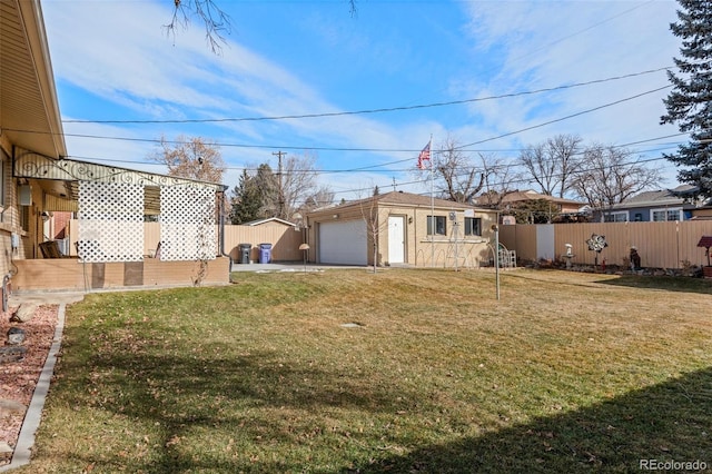 view of yard with an outbuilding and a garage