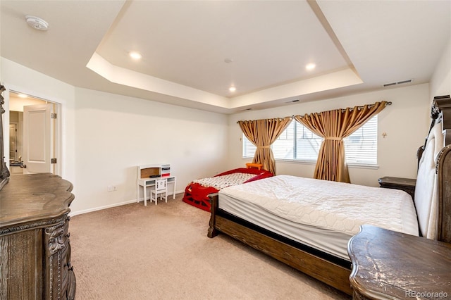 bedroom featuring recessed lighting, carpet floors, visible vents, baseboards, and a tray ceiling