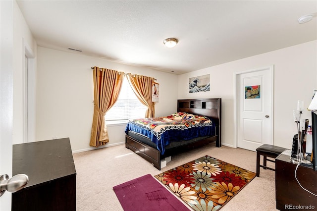 bedroom featuring carpet floors and baseboards