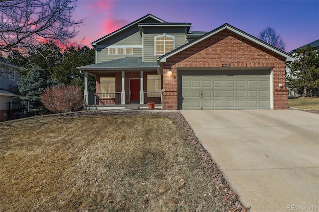 view of front facade featuring a garage, concrete driveway, brick siding, and covered porch