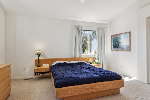 bedroom with carpet floors and baseboards