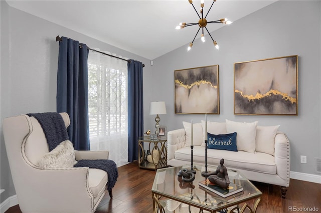 living room featuring vaulted ceiling, dark hardwood / wood-style floors, and a notable chandelier