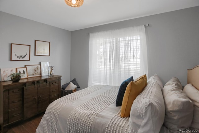 bedroom featuring dark hardwood / wood-style flooring