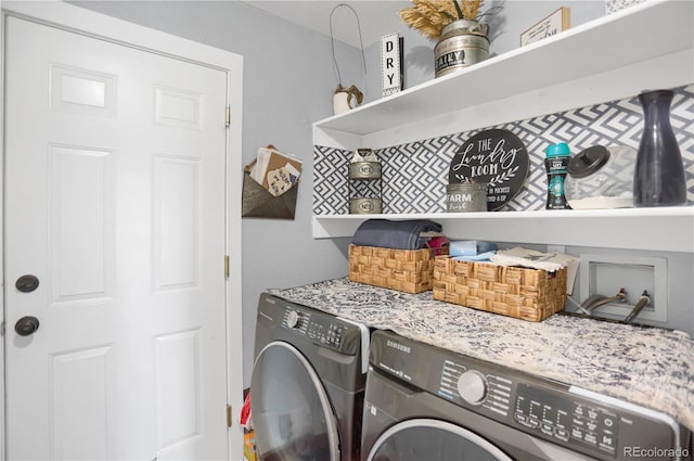 clothes washing area with independent washer and dryer