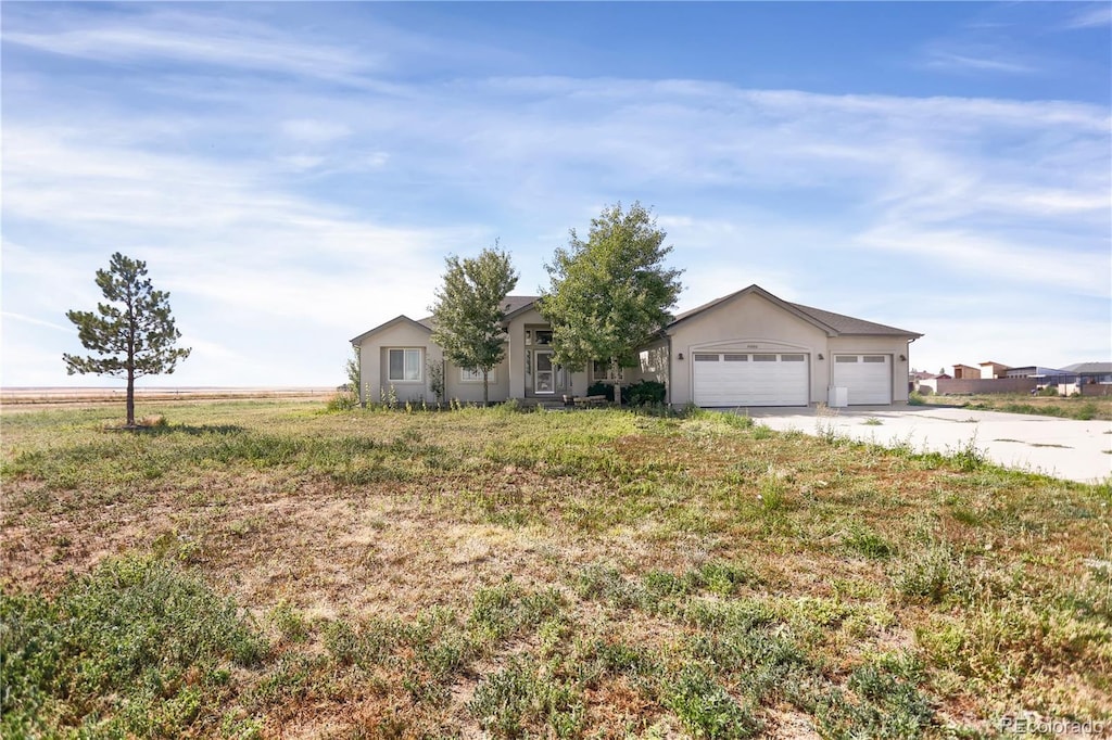 single story home featuring a garage