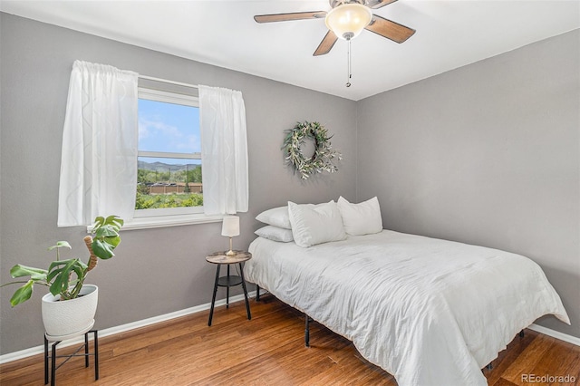 6731 Devinney St, Arvada, CO 80004 - bedroom featuring baseboards, wood finished floors, and ceiling fan