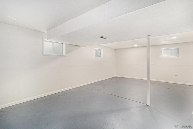 6731 Devinney St, Arvada, CO 80004 - basement with baseboards and recessed lighting