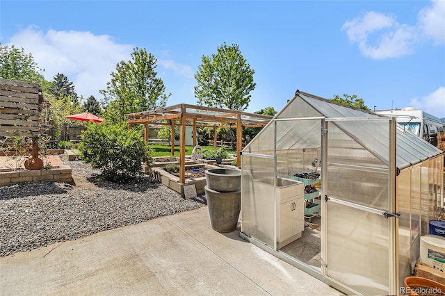 6731 Devinney St, Arvada, CO 80004 - view of patio featuring an exterior structure, an outdoor structure, and fence