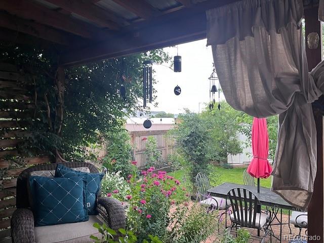 6731 Devinney St, Arvada, CO 80004 - view of patio / terrace with fence
