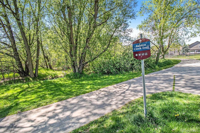6731 Devinney St, Arvada, CO 80004 - view of community with a lawn and driveway