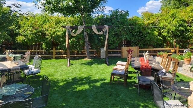 6731 Devinney St, Arvada, CO 80004 - view of jungle gym with view of wooded area