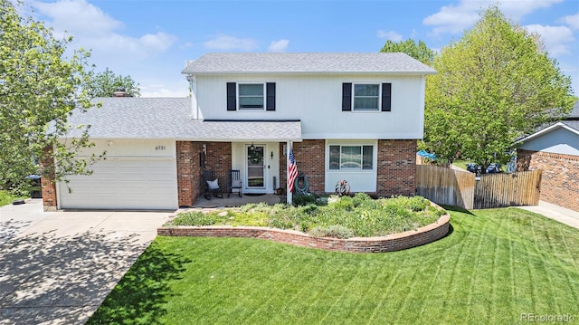 6731 Devinney St, Arvada, CO 80004 - traditional-style home featuring an attached garage, driveway, brick siding, and roof with shingles