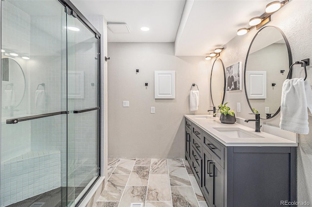 6731 Devinney St, Arvada, CO 80004 - full bathroom with a stall shower, double vanity, and marble look tiles