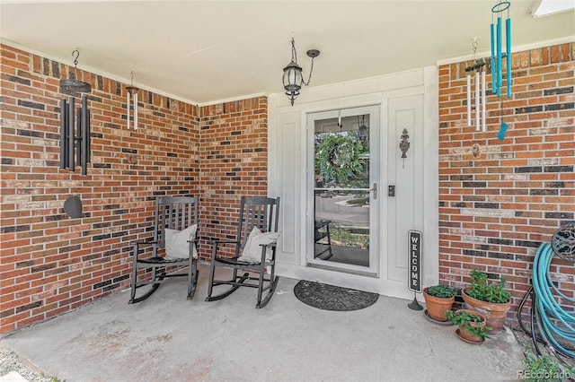 6731 Devinney St, Arvada, CO 80004 - entrance to property with brick siding