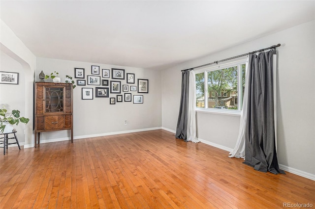 6731 Devinney St, Arvada, CO 80004 - empty room featuring light wood-style flooring and baseboards