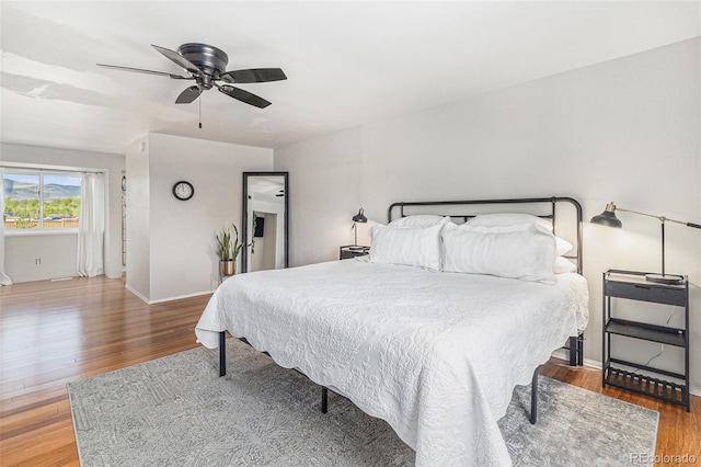 6731 Devinney St, Arvada, CO 80004 - bedroom with wood finished floors, ceiling fan, and baseboards