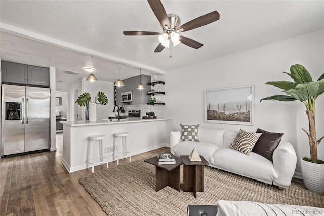 6133 S Sterne Cir, Littleton, CO 80120 - living room featuring visible vents, a ceiling fan, and wood finished floors