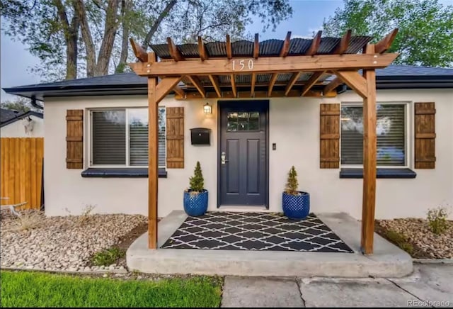 150 S Osceola St, Denver, CO 80219 - view of exterior entry featuring stucco siding
