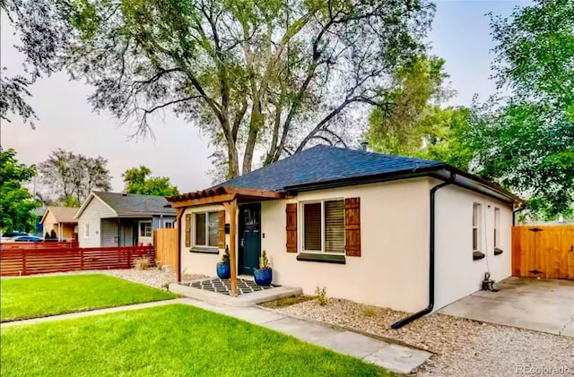 150 S Osceola St, Denver, CO 80219 - rear view of house featuring stucco siding