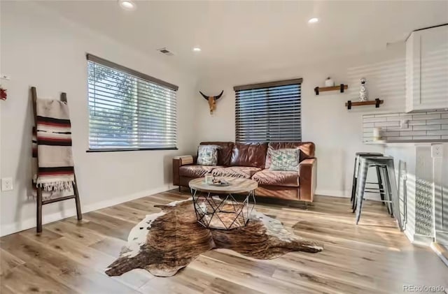 150 S Osceola St, Denver, CO 80219 - living room featuring wood finished floors and recessed lighting