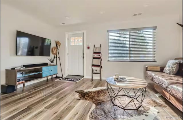 150 S Osceola St, Denver, CO 80219 - living area featuring wood finished floors and baseboards