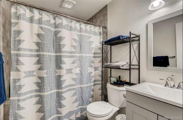 150 S Osceola St, Denver, CO 80219 - full bathroom featuring a textured wall, vanity, and a shower with curtain
