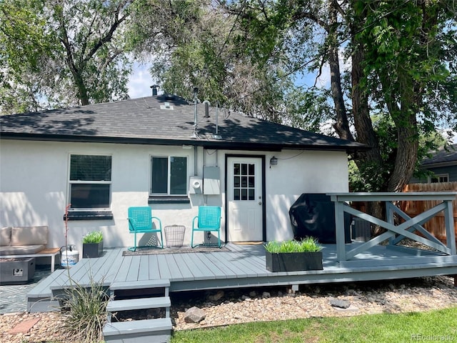 150 S Osceola St, Denver, CO 80219 - rear view of property with stucco siding, a deck, and a shingled roof