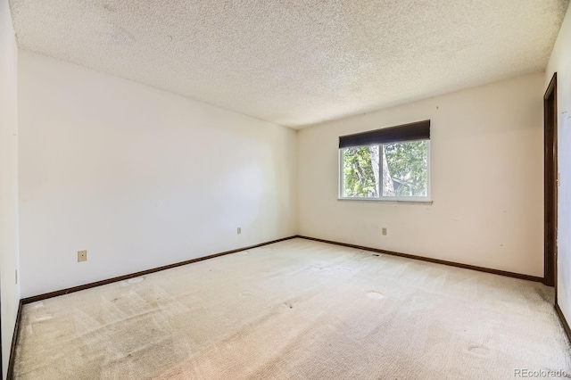 2370 Redwood Ave, Lafayette, CO 80026 - carpeted spare room featuring baseboards and a textured ceiling