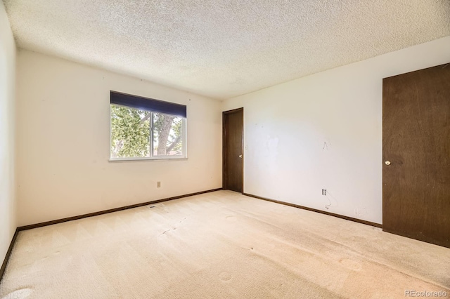 2370 Redwood Ave, Lafayette, CO 80026 - empty room featuring carpet flooring and a textured ceiling