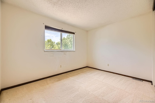 2370 Redwood Ave, Lafayette, CO 80026 - spare room featuring light colored carpet and a textured ceiling