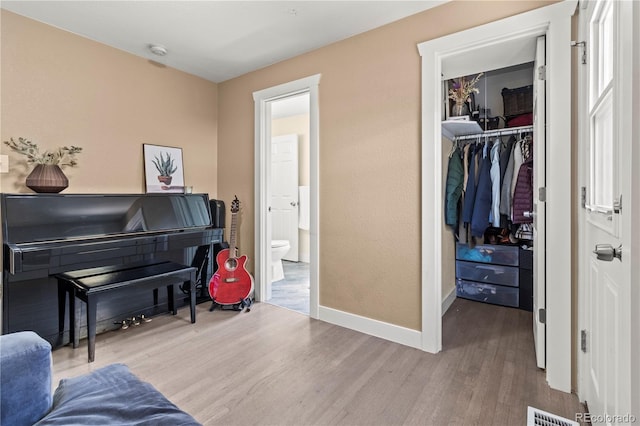 sitting room featuring light hardwood / wood-style flooring