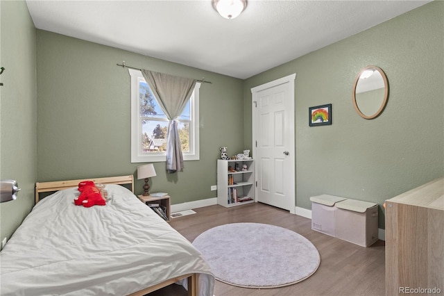 bedroom featuring wood-type flooring